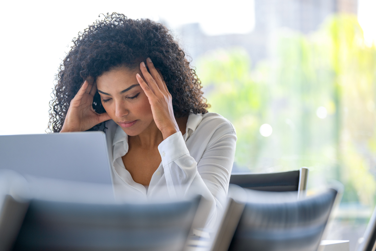 upset woman on laptop